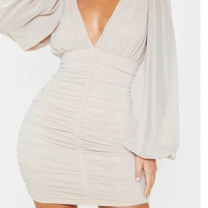 Nude bodycon dress.